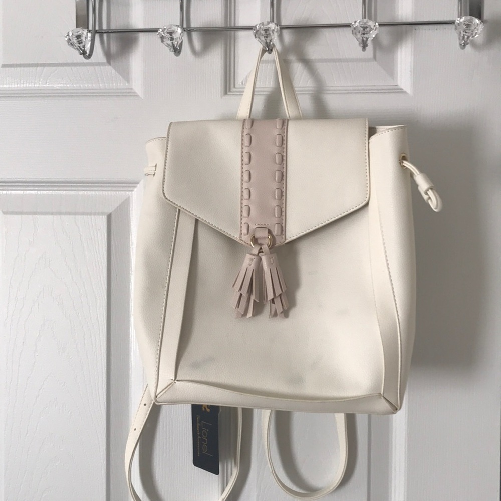 Cream handbag with gold and pink accents